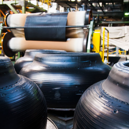 Tire manufacturing facility with partially finished tires